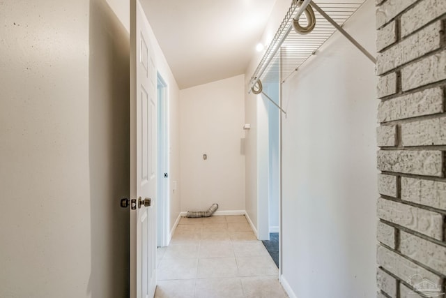 hall featuring light tile patterned floors