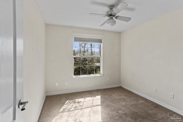 carpeted empty room with ceiling fan