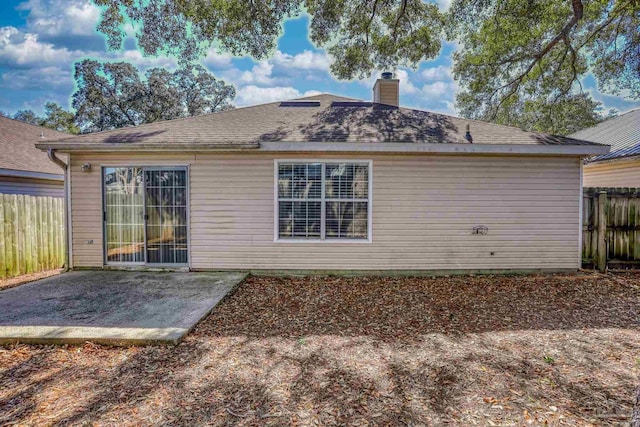 back of property featuring a patio