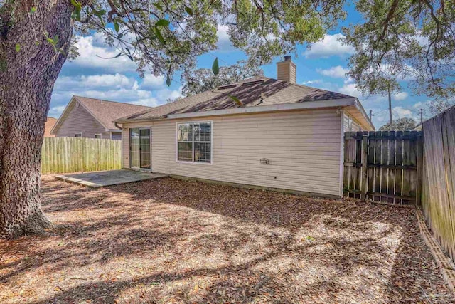 rear view of house with a patio