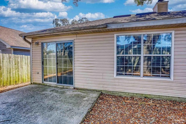 view of side of property with a patio