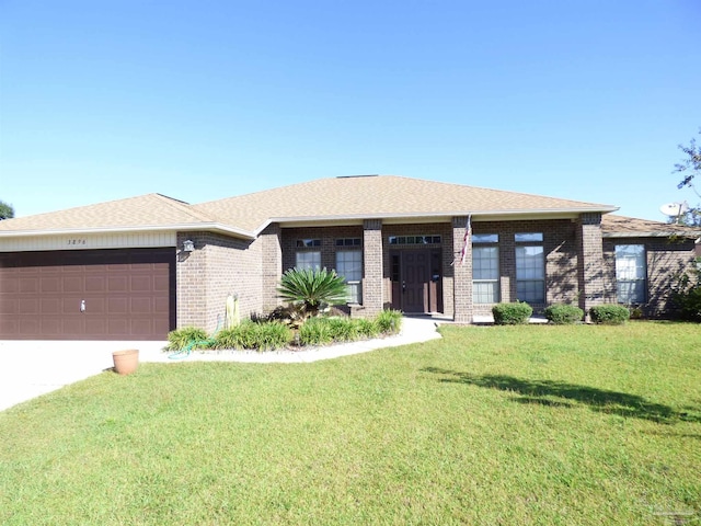 view of front facade featuring a garage and a front yard