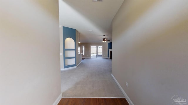 corridor featuring hardwood / wood-style floors