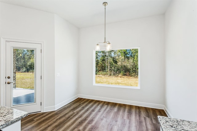 6575 Gentle Rain Dr, Milton, FL 32570 - unfurnished dining area featuring dark wood finished floors and baseboards