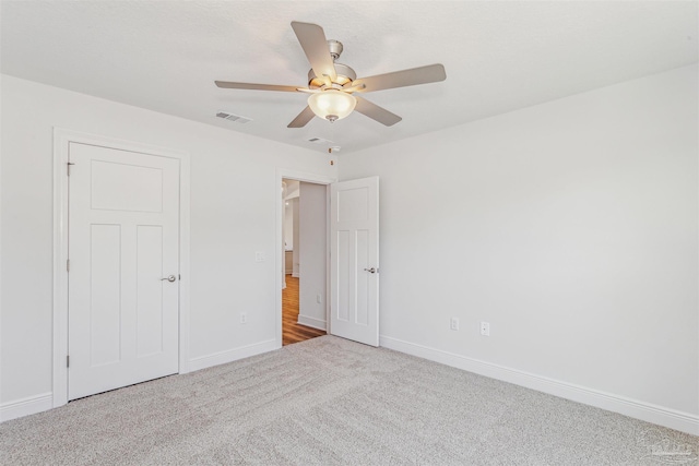 6575 Gentle Rain Dr, Milton, FL 32570 - unfurnished bedroom featuring carpet floors, baseboards, and ceiling fan