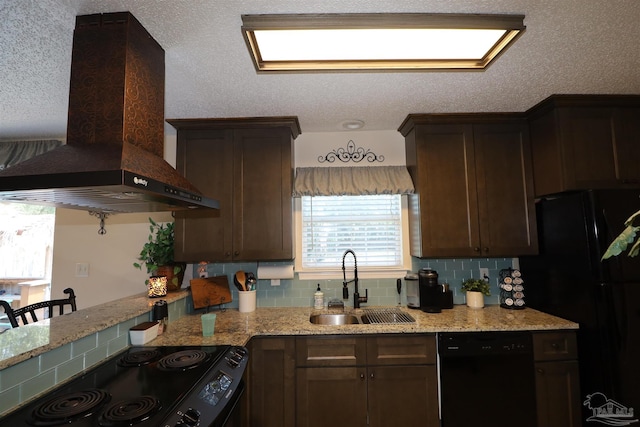 kitchen with decorative backsplash, sink, light stone counters, extractor fan, and black appliances