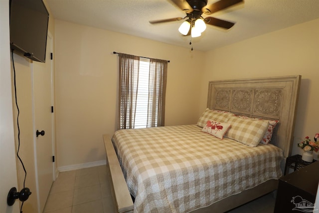 bedroom featuring ceiling fan and light tile patterned floors