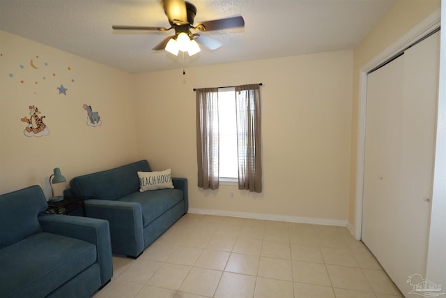 interior space with ceiling fan