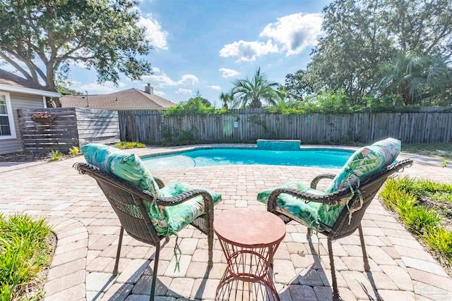 view of swimming pool with a patio area