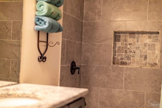 bathroom with tiled shower