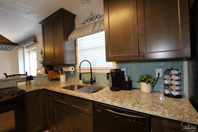 kitchen featuring tasteful backsplash, light stone counters, a textured ceiling, black dishwasher, and stove