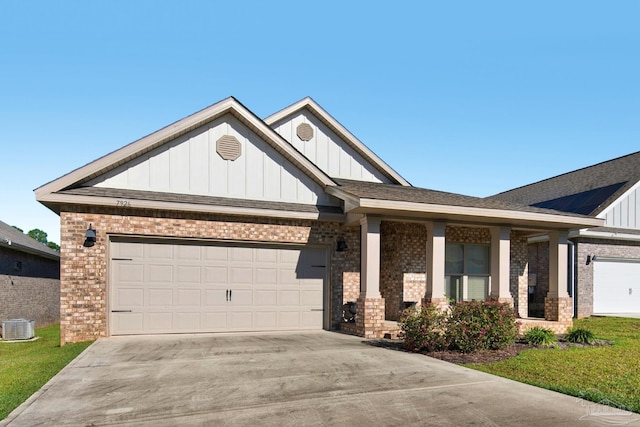 view of front of property with cooling unit and a garage