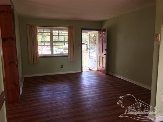 foyer with dark hardwood / wood-style flooring