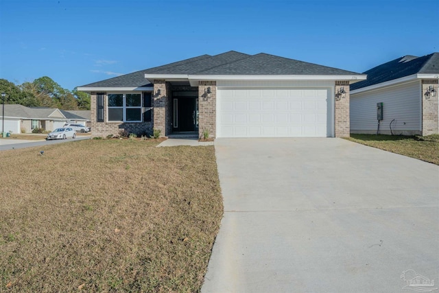 view of front of property featuring a garage and a front yard