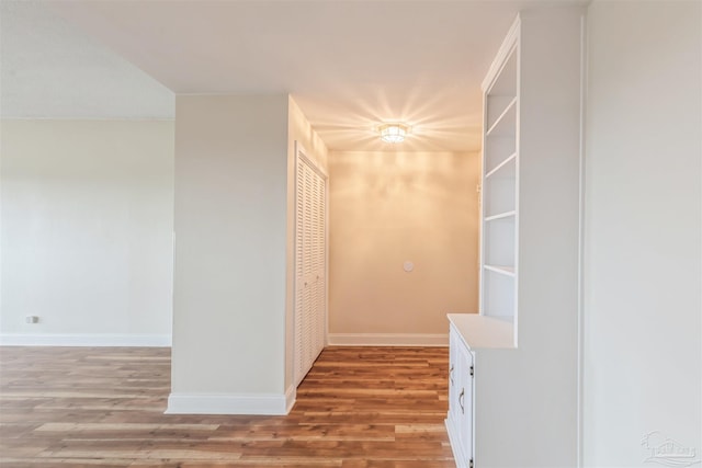 corridor with light wood-type flooring