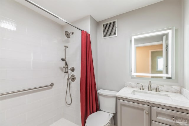 bathroom with toilet, vanity, and a shower with curtain