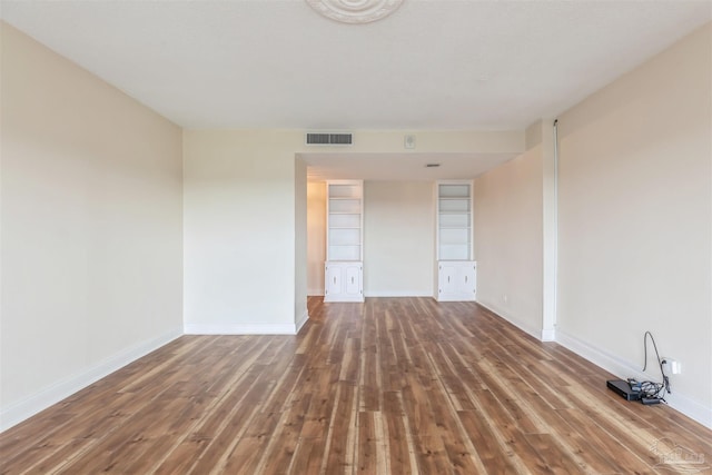 empty room featuring hardwood / wood-style flooring