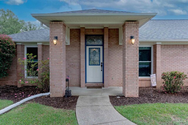 ranch-style house with a front yard and a garage