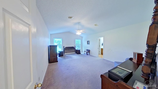 office with ceiling fan, lofted ceiling, carpet floors, and a textured ceiling