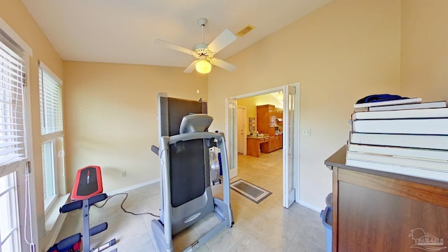 workout room featuring lofted ceiling and ceiling fan