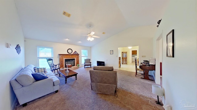 carpeted living room featuring lofted ceiling and ceiling fan