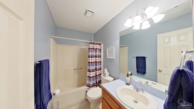 full bathroom featuring tile patterned floors, toilet, shower / tub combo, a textured ceiling, and vanity