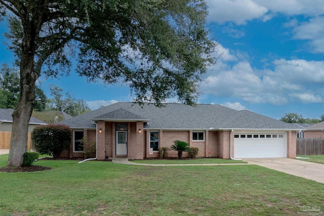 single story home with a garage and a front lawn