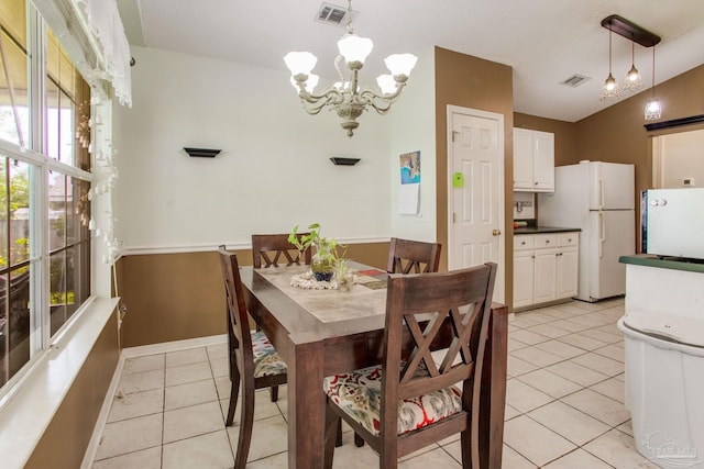 7909 Red Bean Dr, Pensacola, FL 32526 - dining room with light tile patterned floors and a chandelier