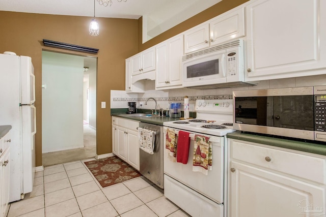 7909 Red Bean Dr, Pensacola, FL 32526 - kitchen featuring stainless steel appliances, white cabinets, dark countertops, and light tile patterned flooring