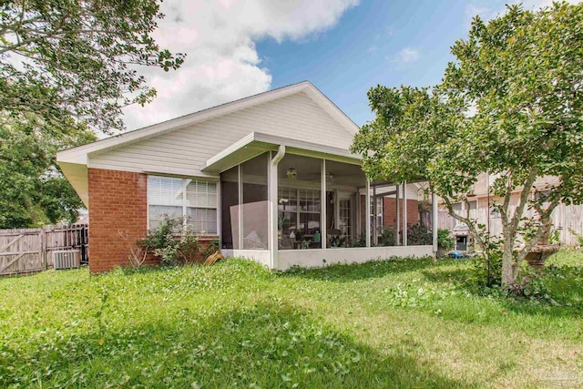 7909 Red Bean Dr, Pensacola, FL 32526 - rear view of house with brick siding and a sunroom