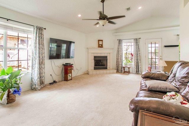 7909 Red Bean Dr, Pensacola, FL 32526 - carpeted living room featuring ceiling fan, lofted ceiling, recessed lighting, and a tiled fireplace