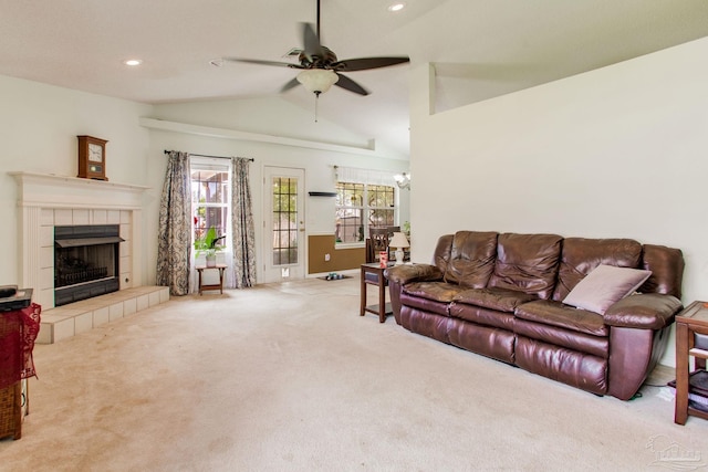 7909 Red Bean Dr, Pensacola, FL 32526 - living room featuring vaulted ceiling, carpet floors, a ceiling fan, a tile fireplace, and recessed lighting
