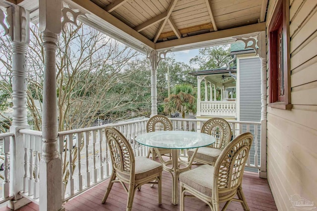 wooden terrace featuring a gazebo and ceiling fan