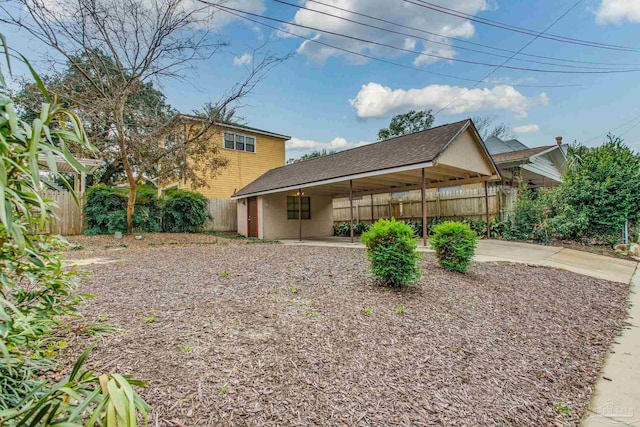 view of side of home featuring a carport