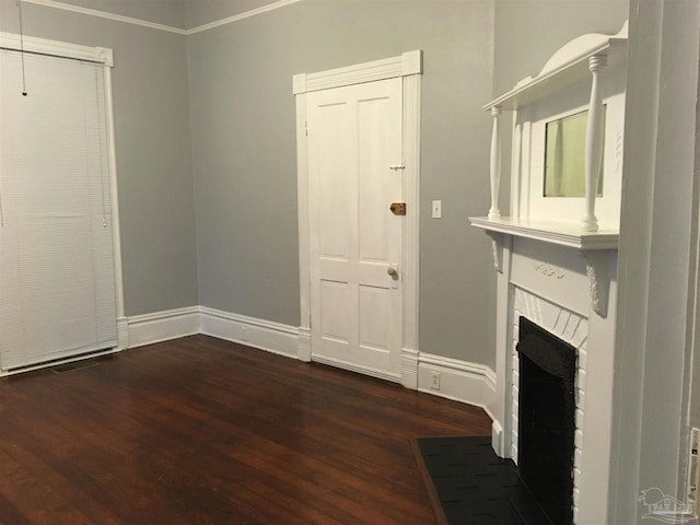 interior space with a fireplace and dark hardwood / wood-style floors