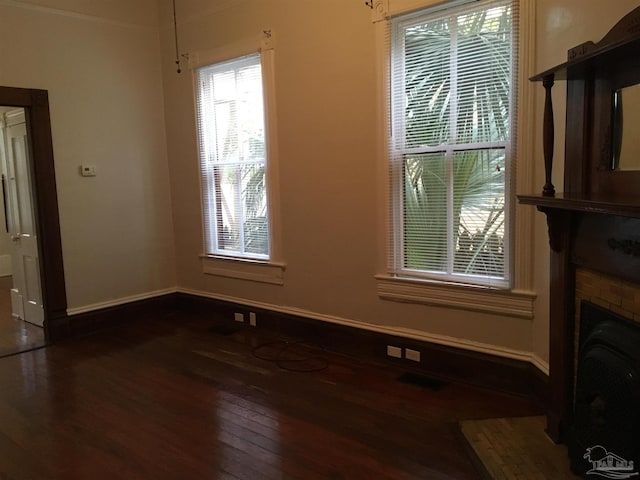 unfurnished living room featuring dark hardwood / wood-style floors