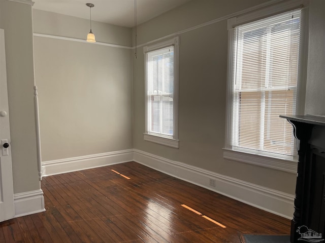 empty room featuring dark wood-type flooring