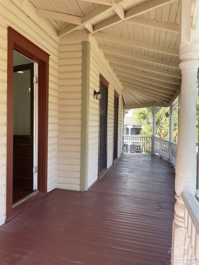 wooden terrace with a porch