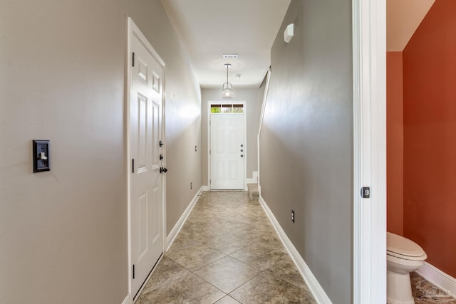 2107 Wilsons Plover Cir, Navarre, FL 32566 - entryway featuring baseboards and light tile patterned flooring