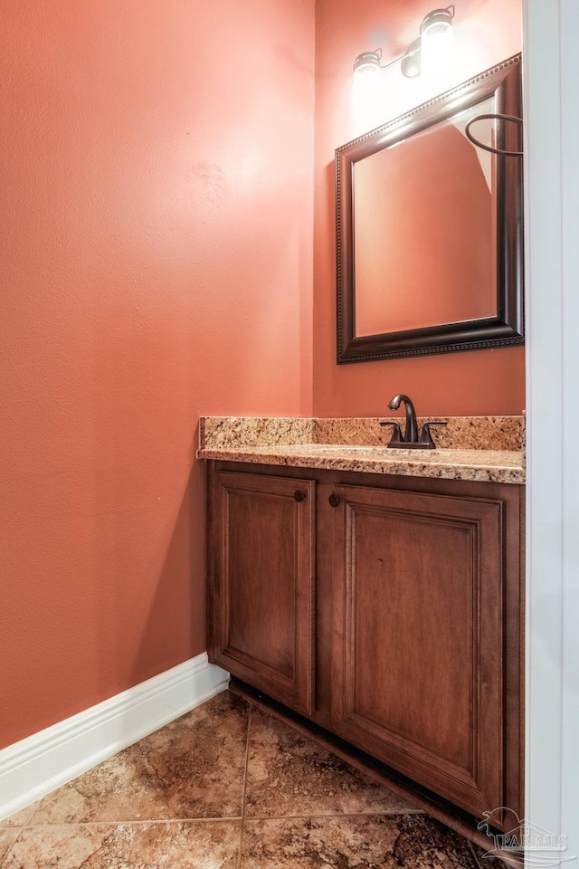 2107 Wilsons Plover Cir, Navarre, FL 32566 - bathroom featuring baseboards and vanity