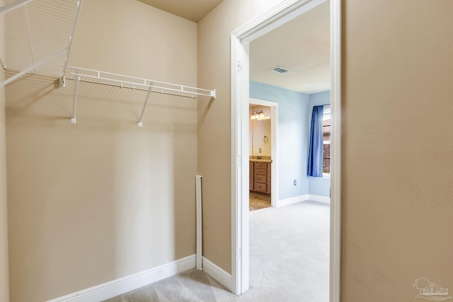 2107 Wilsons Plover Cir, Navarre, FL 32566 - spacious closet featuring carpet floors