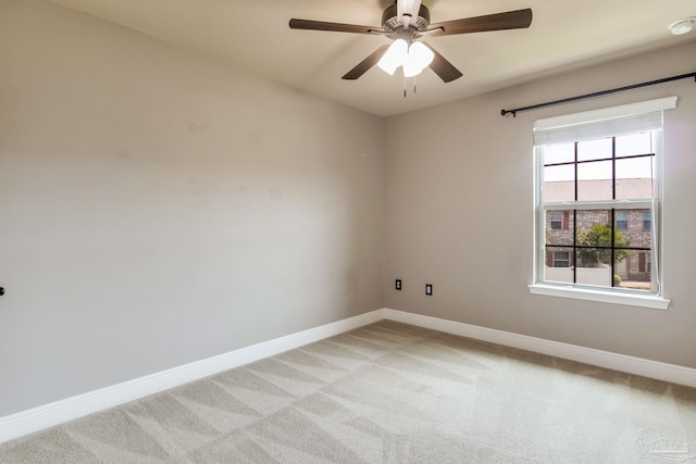 2107 Wilsons Plover Cir, Navarre, FL 32566 - unfurnished room featuring baseboards, light carpet, and ceiling fan