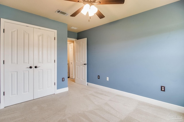 2107 Wilsons Plover Cir, Navarre, FL 32566 - unfurnished bedroom featuring light colored carpet, a closet, baseboards, and ceiling fan