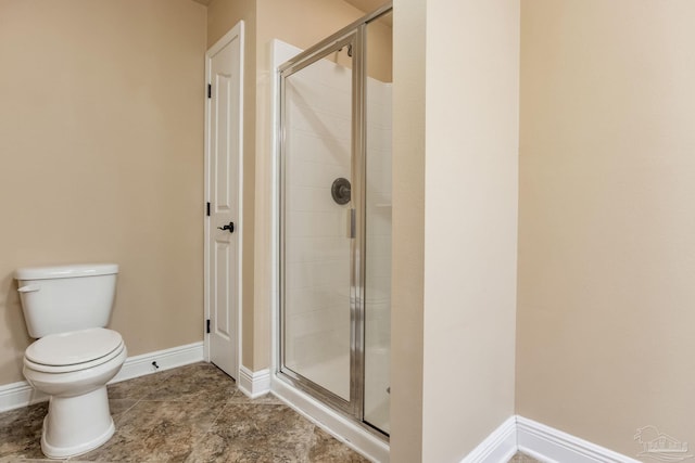 2107 Wilsons Plover Cir, Navarre, FL 32566 - full bathroom with a shower stall, toilet, and baseboards