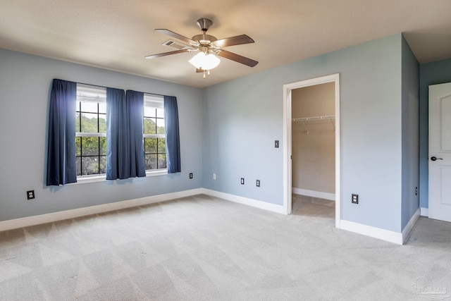 2107 Wilsons Plover Cir, Navarre, FL 32566 - unfurnished bedroom with light carpet, baseboards, and a spacious closet