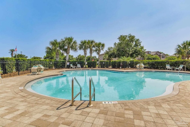 2107 Wilsons Plover Cir, Navarre, FL 32566 - community pool featuring a patio