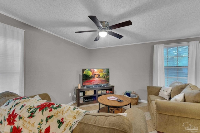 tiled living room with ceiling fan, a textured ceiling, and ornamental molding