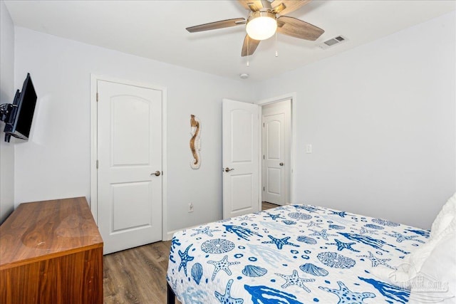 7244 Frankfort St, Navarre, FL 32566 - bedroom with hardwood / wood-style floors and ceiling fan