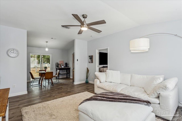 7244 Frankfort St, Navarre, FL 32566 - living room with lofted ceiling, dark wood-type flooring, and ceiling fan