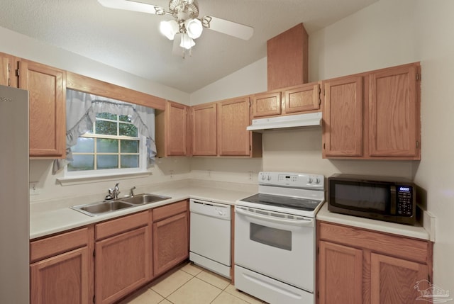 5362 Barbarosa Rd, Gulf Breeze, FL 32563 - kitchen with vaulted ceiling, a sink, white appliances, light countertops, and under cabinet range hood